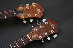 Two Brown Roland G-303 Guitars