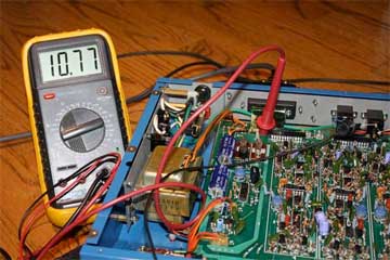 Measuring control line nine, synthesizer volume, with a guitar plugged in to a US-2, and the US-2 output A connected to a GR-300. The voltage reads 10.77 volts.