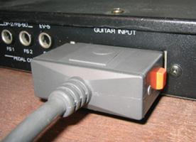The pin-style cable connector (with the same type of end as found on the GK-1 system) with the Roland GM-70.